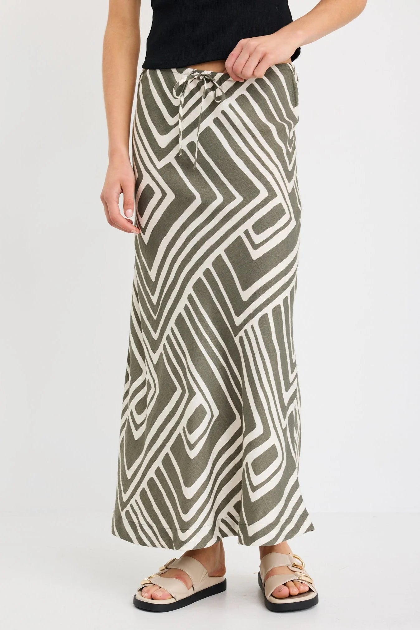 STORIES TO BE TOLD DEPARTURE KHAKI MAZE PRINT TIE WAIST BIAS MAXI SKIRT - THE VOGUE STORE