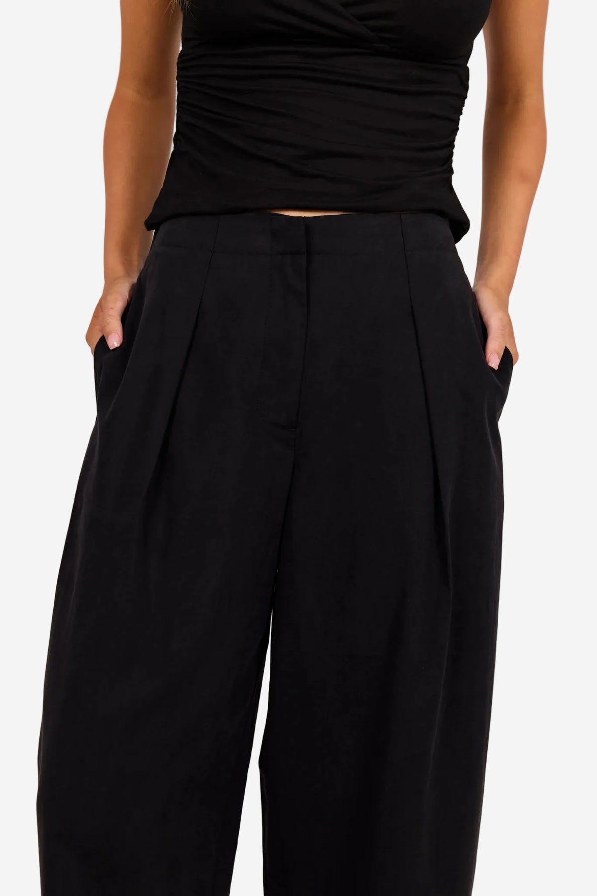STORIES BE TOLD MANIFESTO BLACK FRONT PLEAT BARREL LEG PANTS - THE VOGUE STORE
