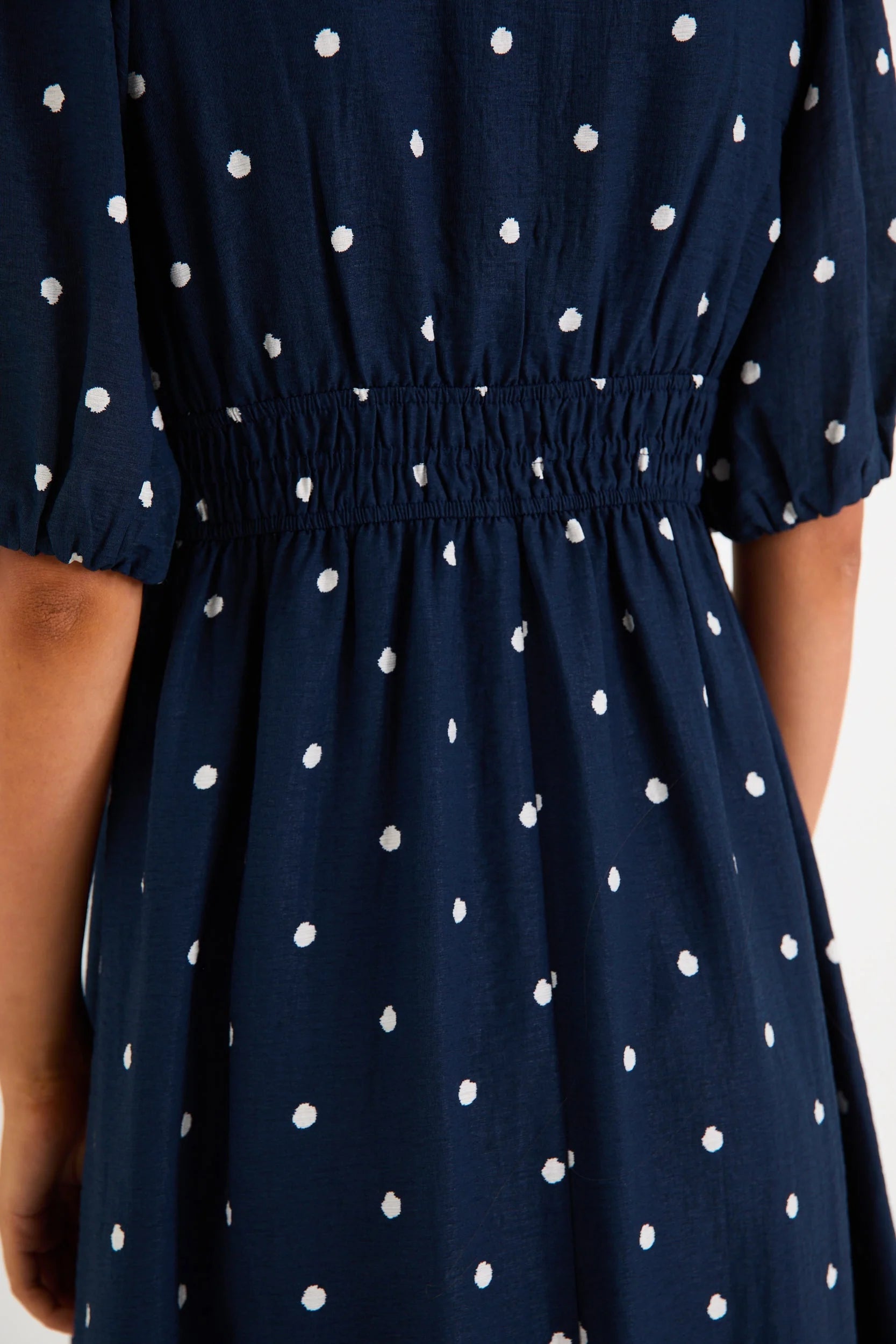 STORIES BE TOLD ELOQUENT NAVY POLKA DOT FLUTTER SLEEVE MAXI DRESS - THE VOGUE STORE