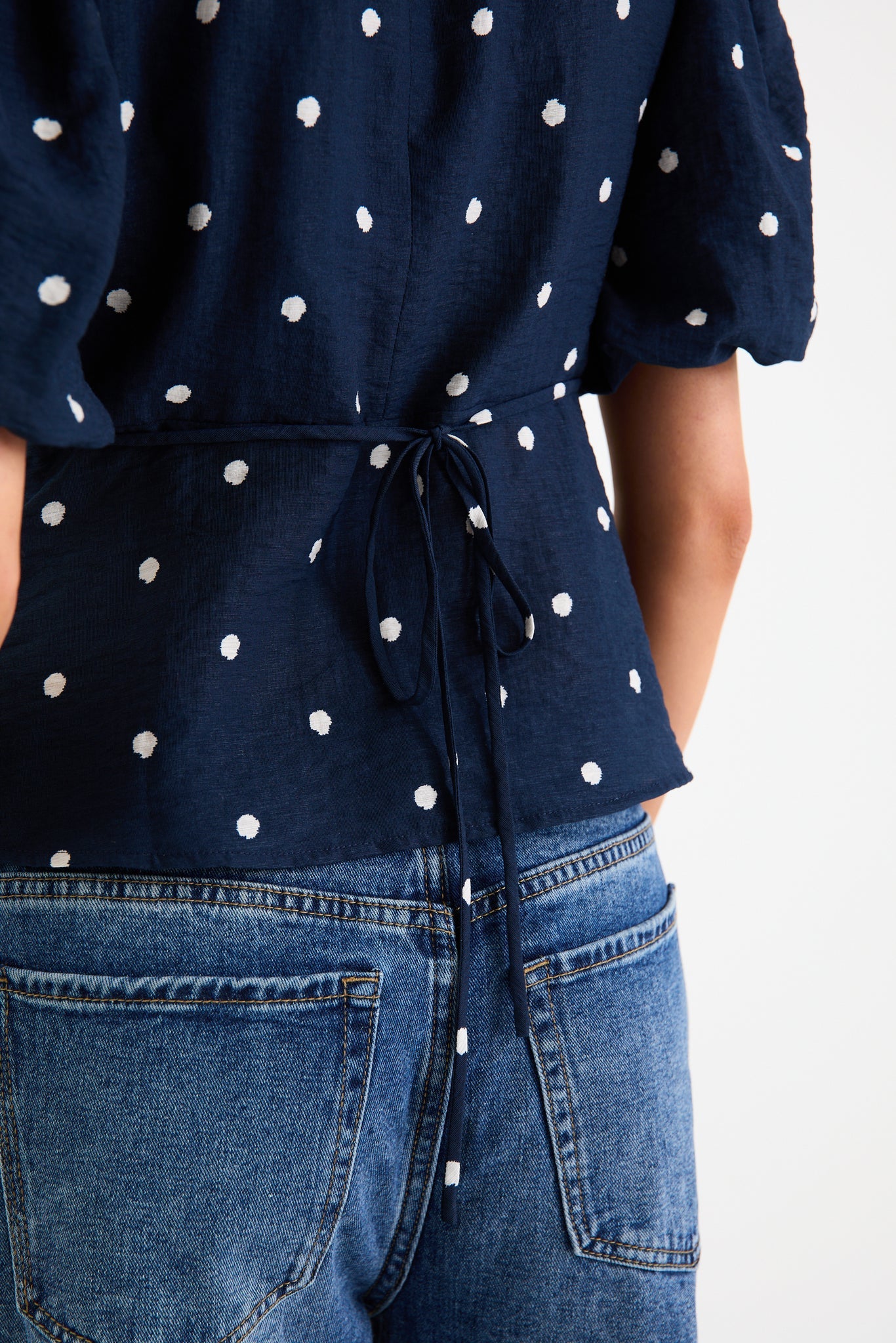 STORIES BE TOLD FINALI NAVY POLKA DOT BUBBLE SLEEVE TOP - THE VOGUE STORE