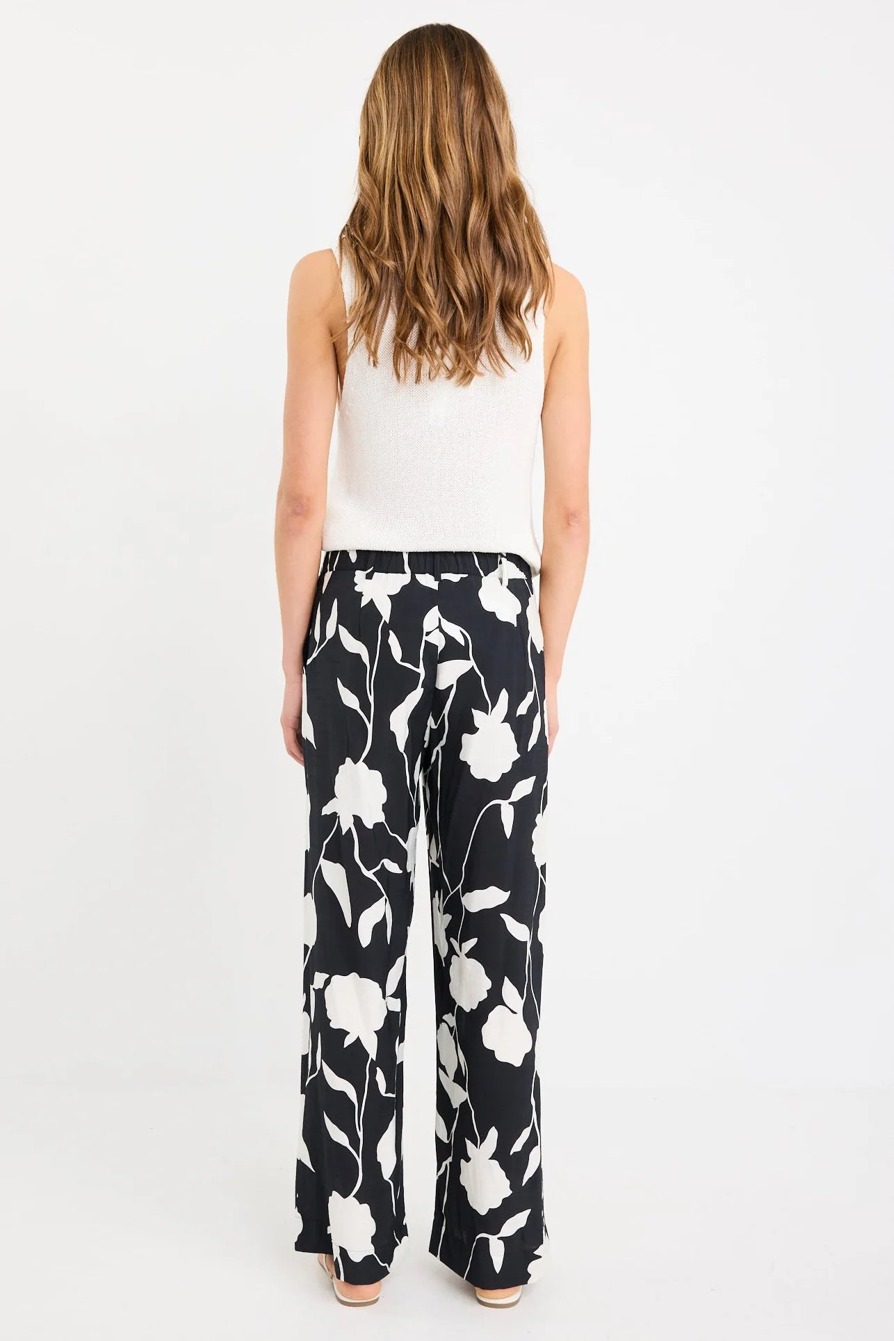 STORIES BE TOLD BENEFICIAL BLACK AND WHITE FLORAL FLAT FRONT ELASTIC BACK PANTS - THE VOGUE STORE
